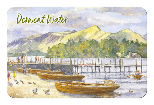 A rectangular magnet with rounded corners featuring a watercolour landscape scene labeled 'Derwent Water.' The artwork shows boats on a lake, a wooden pier, green trees, and mountains under a pale sky.