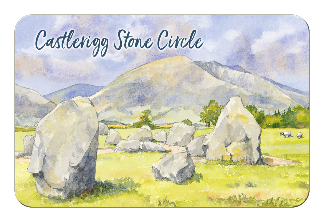 A rectangular fridge magnet with rounded corners featuring a watercolour landscape of Castlerigg Stone Circle, with large stone circles in a grassy field and mountains under a cloudy sky. The text 'Castlerigg Stone Circle' appears across the top.